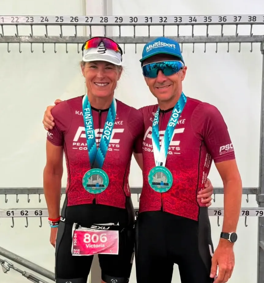 Peak Sports Coaching athletes with Ironman finisher medals